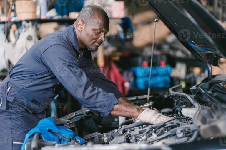garage-mechanic-african-black-male-professional-working-car-auto-service-checking-engine-oil-photo
